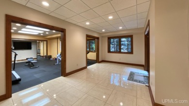 This executive home features 6750 sq. ft. Conveniently located on Marquette Golf Club in Michigan - for sale on GolfHomes.com, golf home, golf lot