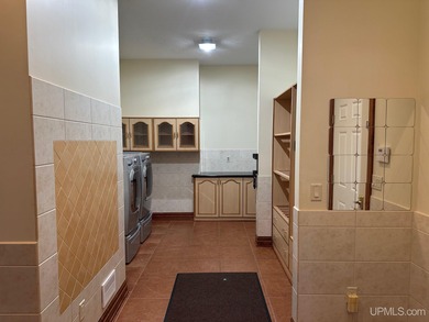 This executive home features 6528 sq. ft. of luxurious space on Marquette Golf Club in Michigan - for sale on GolfHomes.com, golf home, golf lot