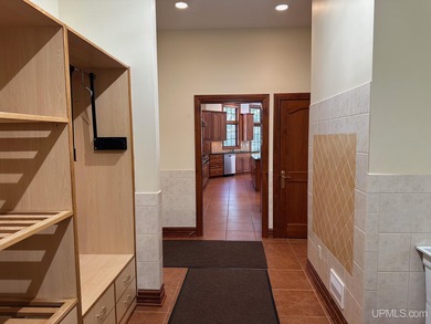 This executive home features 6528 sq. ft. of luxurious space on Marquette Golf Club in Michigan - for sale on GolfHomes.com, golf home, golf lot