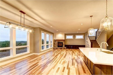 This stunning 4-bedroom, 3-bath custom-built home by Johnson on Boulder Pointe Golf Club in Minnesota - for sale on GolfHomes.com, golf home, golf lot