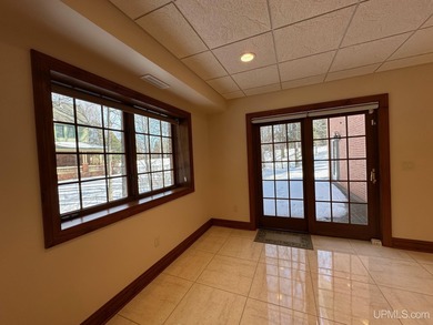 This executive home features 6528 sq. ft. of luxurious space on Marquette Golf Club in Michigan - for sale on GolfHomes.com, golf home, golf lot