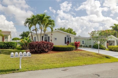 Enjoy peaceful water views and your own Mango Tree from this on Savanna Golf Club in Florida - for sale on GolfHomes.com, golf home, golf lot