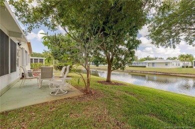 Enjoy peaceful water views and your own Mango Tree from this on Savanna Golf Club in Florida - for sale on GolfHomes.com, golf home, golf lot