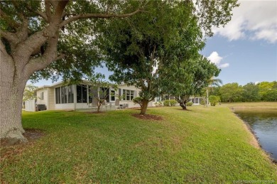 Enjoy peaceful water views and your own Mango Tree from this on Savanna Golf Club in Florida - for sale on GolfHomes.com, golf home, golf lot