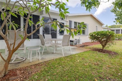 Enjoy peaceful water views and your own Mango Tree from this on Savanna Golf Club in Florida - for sale on GolfHomes.com, golf home, golf lot