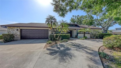 Tucked away among mature trees and lush landscaping, this on IMG Academies Golf and Country Club in Florida - for sale on GolfHomes.com, golf home, golf lot