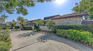 Tucked away among mature trees and lush landscaping, this on IMG Academies Golf and Country Club in Florida - for sale on GolfHomes.com, golf home, golf lot