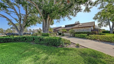 Tucked away among mature trees and lush landscaping, this on IMG Academies Golf and Country Club in Florida - for sale on GolfHomes.com, golf home, golf lot