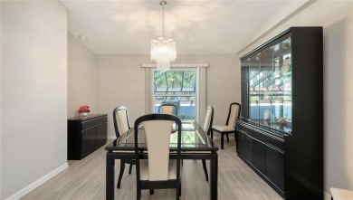 Tucked away among mature trees and lush landscaping, this on IMG Academies Golf and Country Club in Florida - for sale on GolfHomes.com, golf home, golf lot