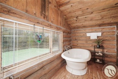 Escape to your own private sanctuary in this quaint log home on on The Briarwood in Montana - for sale on GolfHomes.com, golf home, golf lot
