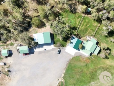 Escape to your own private sanctuary in this quaint log home on on The Briarwood in Montana - for sale on GolfHomes.com, golf home, golf lot