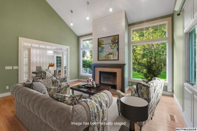 Nestled on over an acre on a scenic private drive, this on Highland Park Golf Course in Iowa - for sale on GolfHomes.com, golf home, golf lot