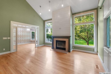 Nestled on over an acre on a scenic private drive, this on Highland Park Golf Course in Iowa - for sale on GolfHomes.com, golf home, golf lot