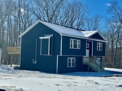 Nestled on a picturesque corner lot within quiet cul-de-sac on Lords Valley Country Club, Inc in Pennsylvania - for sale on GolfHomes.com, golf home, golf lot