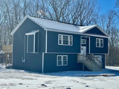 Nestled on a picturesque corner lot within quiet cul-de-sac on Lords Valley Country Club, Inc in Pennsylvania - for sale on GolfHomes.com, golf home, golf lot