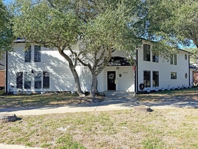 This classic-style 2-story residence is a statement of elegance on Rockport Country Club in Texas - for sale on GolfHomes.com, golf home, golf lot