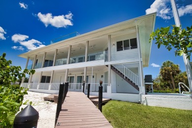 Nestled in a serene enclave, this exceptional property on Coral Creek Club in Florida - for sale on GolfHomes.com, golf home, golf lot