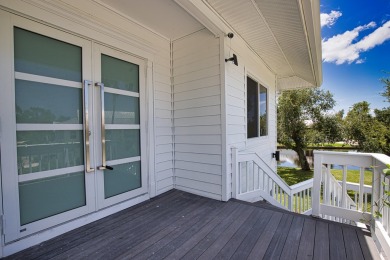 Nestled in a serene enclave, this exceptional property on Coral Creek Club in Florida - for sale on GolfHomes.com, golf home, golf lot