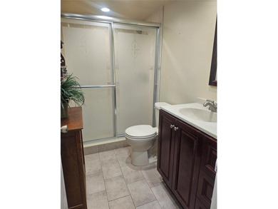 Beautifully maintained 55+ end-unit condo. This light-filled on Sunrise Lakes Phase III in Florida - for sale on GolfHomes.com, golf home, golf lot