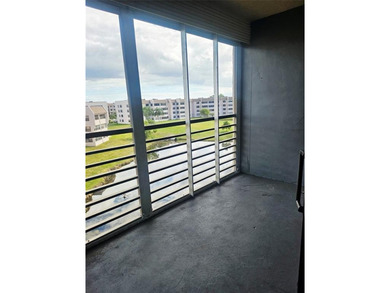 Beautifully maintained 55+ end-unit condo. This light-filled on Sunrise Lakes Phase III in Florida - for sale on GolfHomes.com, golf home, golf lot