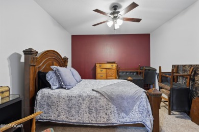Welcome to 702 Copper Oaks Drive, a stunning 4-bedroom, 3-bath on Briarbrook Golf Course in Missouri - for sale on GolfHomes.com, golf home, golf lot