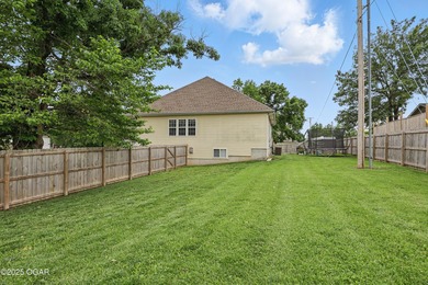 Welcome to 702 Copper Oaks Drive, a stunning 4-bedroom, 3-bath on Briarbrook Golf Course in Missouri - for sale on GolfHomes.com, golf home, golf lot