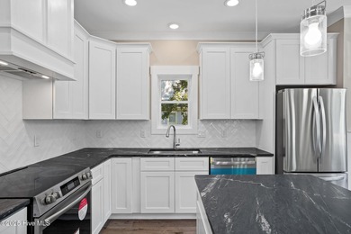 Experience the perfect blend of modern luxury and coastal charm on Brick Landing Plantation Yacht and Golf Club in North Carolina - for sale on GolfHomes.com, golf home, golf lot