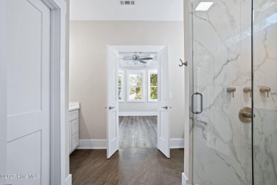 Experience the perfect blend of modern luxury and coastal charm on Brick Landing Plantation Yacht and Golf Club in North Carolina - for sale on GolfHomes.com, golf home, golf lot
