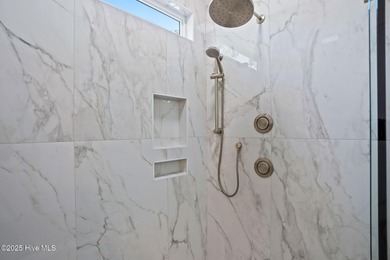 Experience the perfect blend of modern luxury and coastal charm on Brick Landing Plantation Yacht and Golf Club in North Carolina - for sale on GolfHomes.com, golf home, golf lot