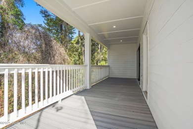 Experience the perfect blend of modern luxury and coastal charm on Brick Landing Plantation Yacht and Golf Club in North Carolina - for sale on GolfHomes.com, golf home, golf lot