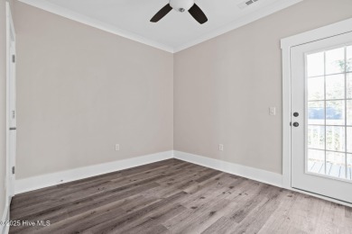 Experience the perfect blend of modern luxury and coastal charm on Brick Landing Plantation Yacht and Golf Club in North Carolina - for sale on GolfHomes.com, golf home, golf lot