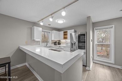 Fully furnished and thoughtfully updated, this two-level condo on Harbour Point Golf Club in North Carolina - for sale on GolfHomes.com, golf home, golf lot