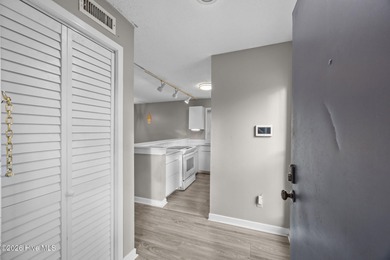 Fully furnished and thoughtfully updated, this two-level condo on Harbour Point Golf Club in North Carolina - for sale on GolfHomes.com, golf home, golf lot