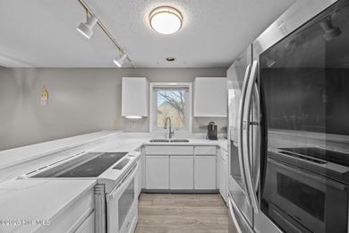 Fully furnished and thoughtfully updated, this two-level condo on Harbour Point Golf Club in North Carolina - for sale on GolfHomes.com, golf home, golf lot