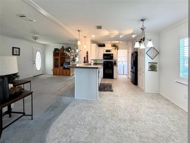 Live the Florida Dream! This stunning 2-bedroom, 2-bath home on Apollo Beach Golf and Sea Club in Florida - for sale on GolfHomes.com, golf home, golf lot