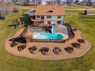 Located on a sprawling 2.3-acre lot, this 4-bedroom, 3-full on Springbrook Country Club in Iowa - for sale on GolfHomes.com, golf home, golf lot