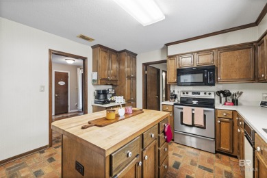 Welcome to this inviting 3-bedroom, 2.5-bath home on the golf on Lake Forest Yacht and Country Club in Alabama - for sale on GolfHomes.com, golf home, golf lot