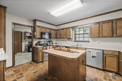 Welcome to this inviting 3-bedroom, 2.5-bath home on the golf on Lake Forest Yacht and Country Club in Alabama - for sale on GolfHomes.com, golf home, golf lot