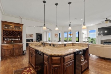 This is a stunning reverse 1.5-story home with picturesque views on Fred Arbanas Golf Course At Longview Lakes - Longview Lake in Missouri - for sale on GolfHomes.com, golf home, golf lot