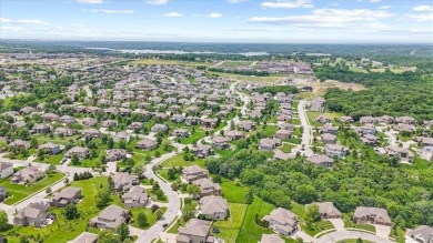 This is a stunning reverse 1.5-story home with picturesque views on Fred Arbanas Golf Course At Longview Lakes - Longview Lake in Missouri - for sale on GolfHomes.com, golf home, golf lot