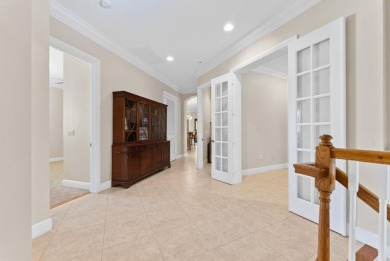 Behind a breathtaking guard-gated entrance, manicured on Parkland Golf Club in Florida - for sale on GolfHomes.com, golf home, golf lot