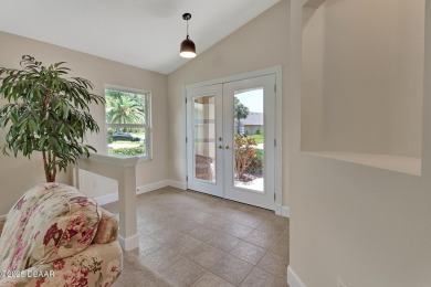 Discover this impeccably maintained pool home located on the on Plantation Bay Golf and Country Club in Florida - for sale on GolfHomes.com, golf home, golf lot