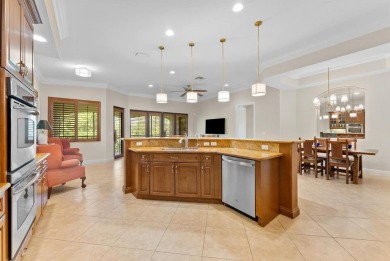 Behind a breathtaking guard-gated entrance, manicured on Parkland Golf Club in Florida - for sale on GolfHomes.com, golf home, golf lot