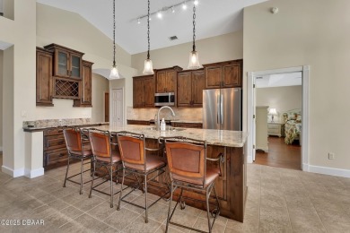 Discover this impeccably maintained pool home located on the on Plantation Bay Golf and Country Club in Florida - for sale on GolfHomes.com, golf home, golf lot