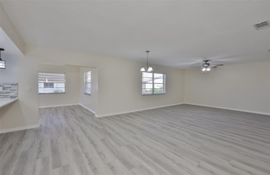 Experience modern comfort and thoughtful upgrades in this on Falcon Watch Golf Club in Florida - for sale on GolfHomes.com, golf home, golf lot