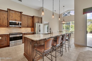 Discover this impeccably maintained pool home located on the on Plantation Bay Golf and Country Club in Florida - for sale on GolfHomes.com, golf home, golf lot