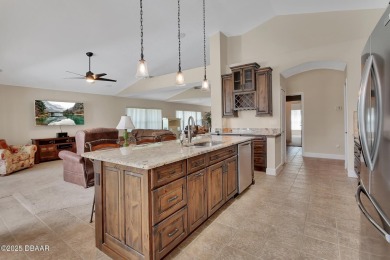 Discover this impeccably maintained pool home located on the on Plantation Bay Golf and Country Club in Florida - for sale on GolfHomes.com, golf home, golf lot