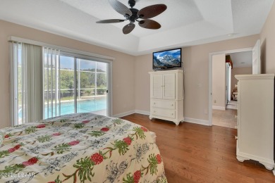 Discover this impeccably maintained pool home located on the on Plantation Bay Golf and Country Club in Florida - for sale on GolfHomes.com, golf home, golf lot