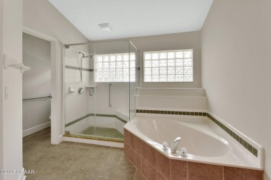 Discover this impeccably maintained pool home located on the on Plantation Bay Golf and Country Club in Florida - for sale on GolfHomes.com, golf home, golf lot