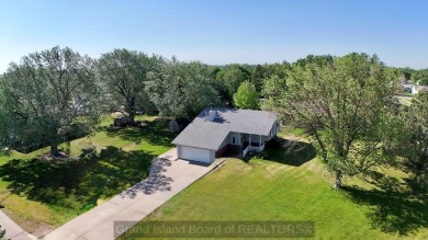 This charming home sits on a large lot with mature trees on the on Indianhead Golf Club in Nebraska - for sale on GolfHomes.com, golf home, golf lot